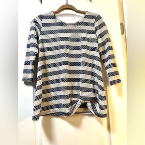 Women’s Sunday navy blue and cream colored stripe top with gathering on bottom.